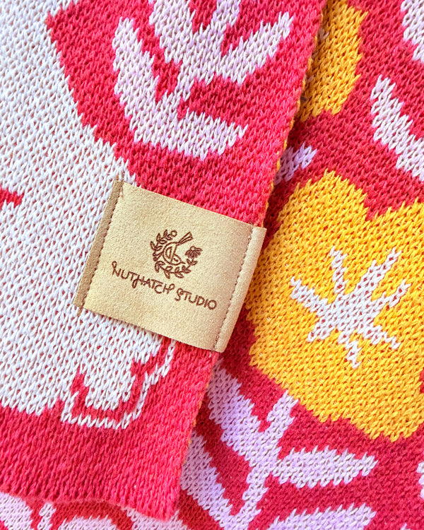 Bunny Meadows Throw Blanket - Coral