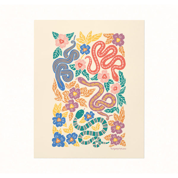 Archival print of a bold & colorful illustration featuring snakes slithering through a floral garden patch on an ivory backdrop.