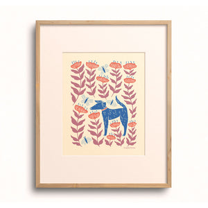 Petal Pup art print by Chrissie Van Hoever displayed in a wooden frame with a white mat.