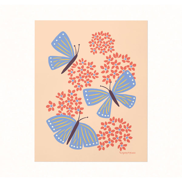 Archival-quality illustrated art print of butterflies fluttering amongst milkweed blooms on a soft peach-colored background.