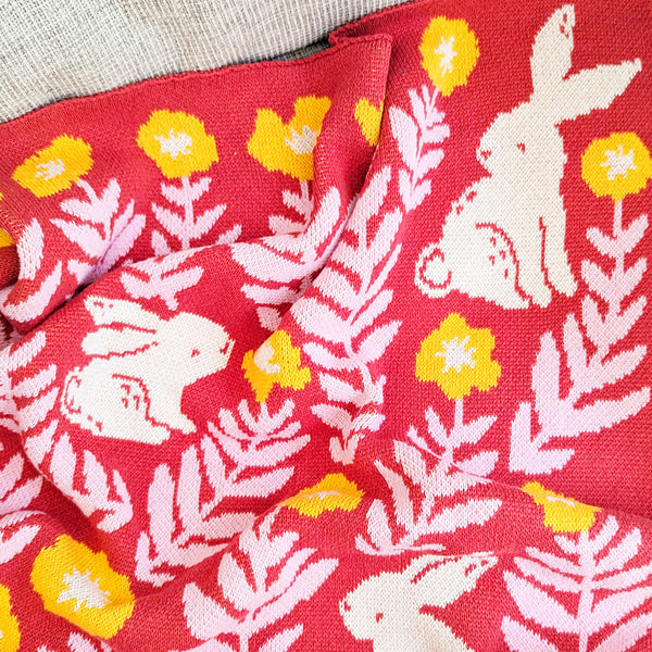 Bunny Meadows Throw Blanket - Coral