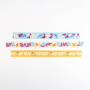 Three strips of colorful washi tape featuring bluebirds, hummingbirds, and chickadees by Nuthatch Studio.