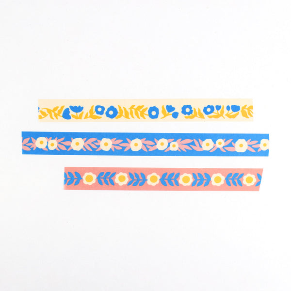 Three strips of colorful floral washi tape by Nuthatch Studio.