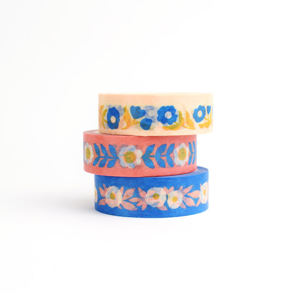 Three rolls of colorful floral washi tape by Nuthatch Studio.