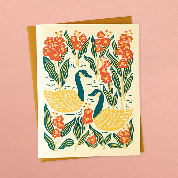 Holiday greeting card with illustration of geese in lake with flowers