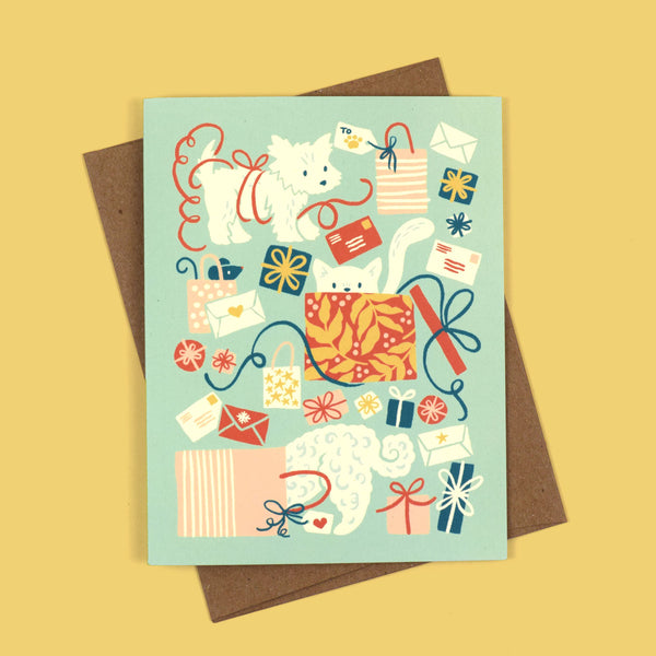 Greeting card with illustration of dogs and cat with Christmas gifts