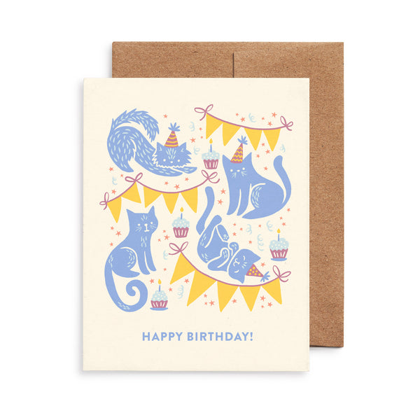 Happy birthday greeting card featuring festive party cats illustration by Chrissie Van Hoever