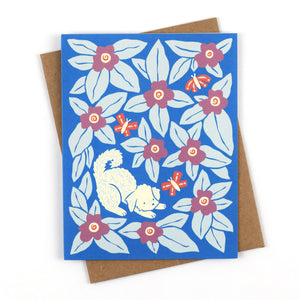 Greeting card with the illustration Bennie Blooms by Chrissie Van Hoever featuring a curly pup playing amidst blooms and butterflies.