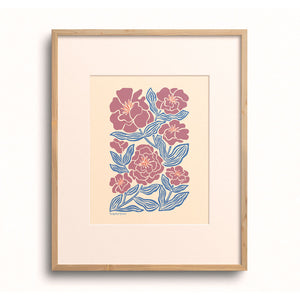 Camellia Blooms art print displayed in a wooden frame.
