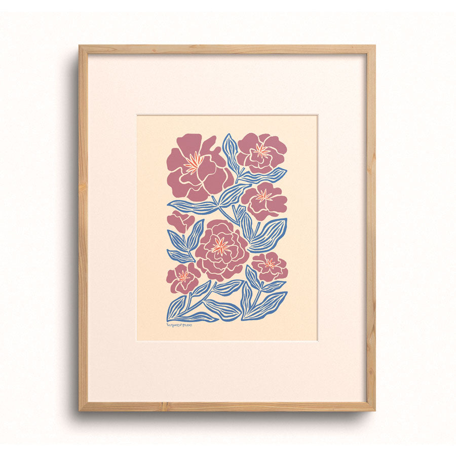 Camellia Blooms art print displayed in a wooden frame.