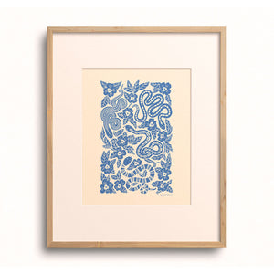 Cerulean Garden Snakes art print displayed in a wooden frame.