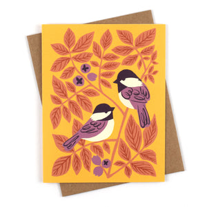 Illustrated greeting card with chickadees and hickory leaves on a cheery yellow background.