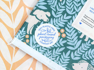 Close up view of a package label that reads “Plant-based packaging. 100% plastic free. Compost me!”
