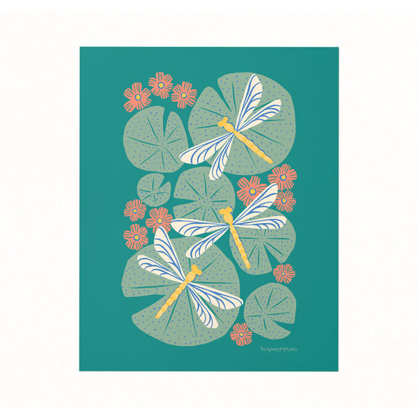 Archival print of an illustration featuring a trio of dragonflies over a pond of blooming lily pads.