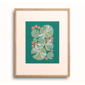 Lilies & Dragonflies art print displayed in a wooden frame.