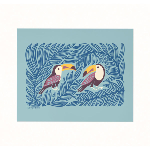 Archival print of an illustration featuring a pair of colorful toucans sheltered in the leaves on a soft blue background.
